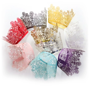 Elegant laser-cut lace cupcake wrappers in various pearlescent colors for wedding decor
