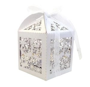 Detailed laser-cut white candy box with floral patterns and a soft chiffon ribbon bow