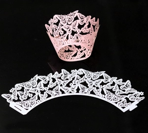 Detailed laser-cut butterfly and flower pattern cupcake wrappers in pink and white colors