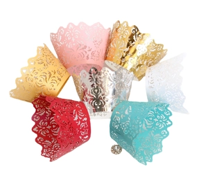 Laser cut lace cupcake wrappers in various metallic colors for festive party decorations