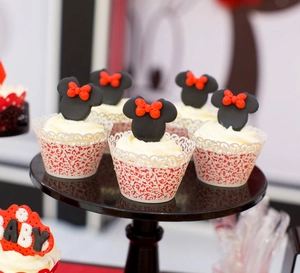 Detailed laser-cut vine cupcake wrappers with red Minnie mouse themed decorative picks