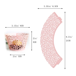 Pink laser cut cupcake wrappers with floral vine pattern and precise sizing measurements