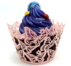 Detail of laser-cut butterfly cupcake wrapper in light pink paper with floral hollow pattern
