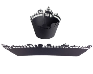 Laser-cut Halloween cake wrappers featuring matte black pumpkin and castle silhouettes