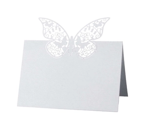 Detailed view of white laser-cut butterfly place cards made of premium pearlescent paper
