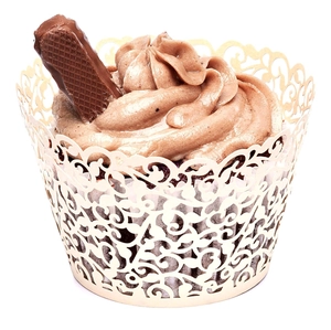 Detail of laser-cut gold cupcake wrapper with intricate floral vine hollow patterns