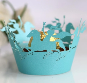 Detail of light blue laser-cut cupcake wrapper with rider and horse silhouette pattern