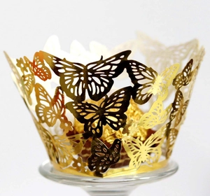 Intricate laser-cut gold butterfly cupcake wrapper for wedding party dessert decoration