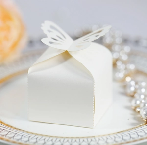 Elegant white pearlescent paper candy box with hollow butterfly lid for wedding favors