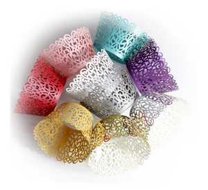 Laser-cut cupcake wrappers in multiple colors with intricate European floral patterns