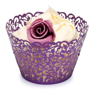 Elegant purple laser-cut cupcake wrappers with floral vine pattern for dessert display