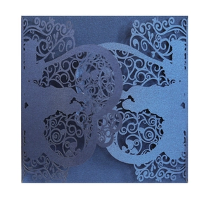 Laser cut navy blue wedding invitation cover with intricate floral patterns
