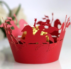 Red laser-cut cupcake wrapper with medieval knight silhouettes for party decoration