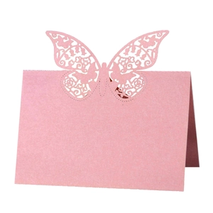 Pink laser-cut butterfly table name cards for elegant wedding and party seating
