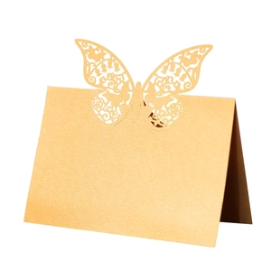 Champagne gold laser-cut butterfly place card made of pearlized paper for weddings
