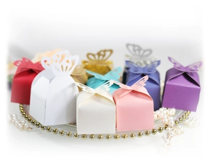 Laser cut butterfly wedding favor boxes in various colors for candies and chocolate