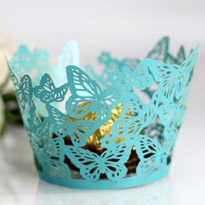 Tiffany blue butterfly laser-cut cupcake wrappers surrounding a gold-wrapped chocolate