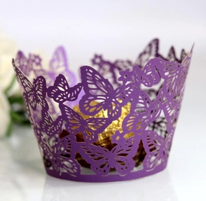 Detailed laser-cut dark purple pearl paper cupcake wrapper with elegant butterfly motifs