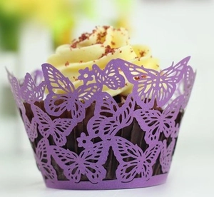 Detailed laser-cut butterfly cupcake wrapper in purple with delicate floral patterns