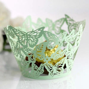 Detailed laser-cut light green butterfly cupcake wrapper featuring intricate hollow patterns