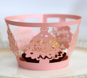 Pink laser cut cupcake wrapper with Christmas tree and Merry Christmas hollow design