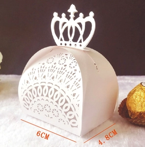 Detail view of white laser-cut crown candy box showing 6cm x 4.8cm size measurements