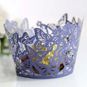 Macro detail of laser-cut butterfly cupcake wrapper in elegant pearlescent purple paper