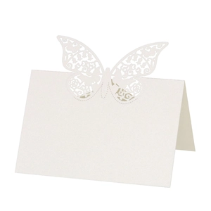 Elegant white laser-cut butterfly place card made of premium pearlescent paper for weddings
