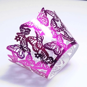 Detailed laser-cut purple butterfly hollow cupcake wrapper in elegant pearl paper finish