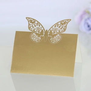 Detail of laser cut gold butterfly place card for weddings with metallic finish