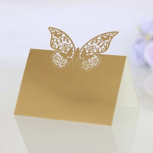 Detailed laser-cut butterfly place card in gold mirror cardstock for elegant weddings