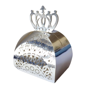 Detailed laser-cut silver crown favor box with intricate floral patterns for weddings