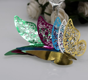 Detail of 3D laser-cut hollow butterfly cards with premium metallic texture for wedding decor