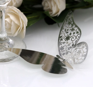 Macro shot of laser-cut hollow butterfly card with elegant silver metallic finish