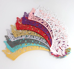 Macro view of laser-cut butterfly cupcake wrappers in various vibrant colors