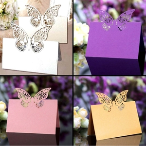 Laser-cut butterfly place cards in pearl paper for weddings and elegant banquets