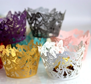 Detailed laser-cut cupcake wrappers featuring elegant hollow butterfly patterns in various colors