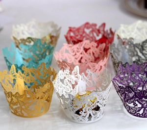 Macro detail of laser-cut butterfly cupcake wrappers in various pearlescent colors