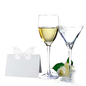 Laser cut butterfly place cards for wedding tables with elegant white paper carving