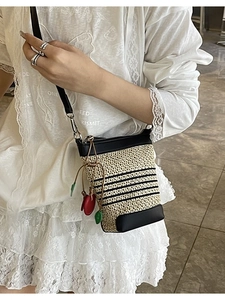Rainbow woven straw bucket bag with black stripes and cherry charm for summer
