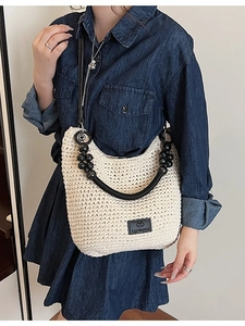 Contrast wax rope woven shoulder bag with black wooden beads and leather strap detail