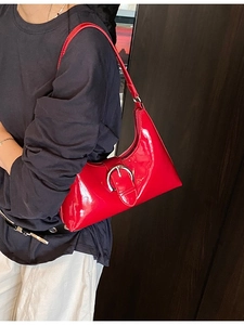 Retro red patent leather underarm shoulder bag with large silver buckle and glossy finish