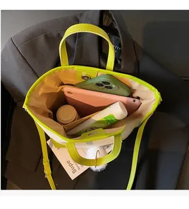 Top view of large tote bag interior showing ample storage for a tablet and daily essentials