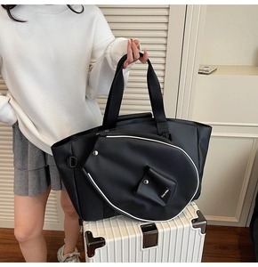 Detail of black large capacity tote bag and matching badminton racket shaped zipper pouch
