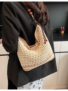 Hollow out woven hobo bag with large wooden beads and adjustable shoulder strap