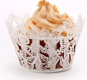 White butterfly laser-cut cupcake wrappers with elegant lace design for party decor