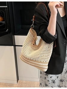 Chic cream hollow crochet tote bag with brown straps and wooden bead accents