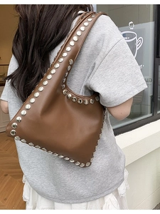 Brown leather tote bag with silver studs and large capacity for daily fashion