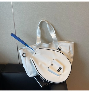 Detail of white sports tote bag showing the matching badminton racket cover and D-ring