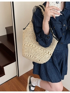 Handmade woven straw shoulder bag with contrast strap for summer leisure and beach vacation